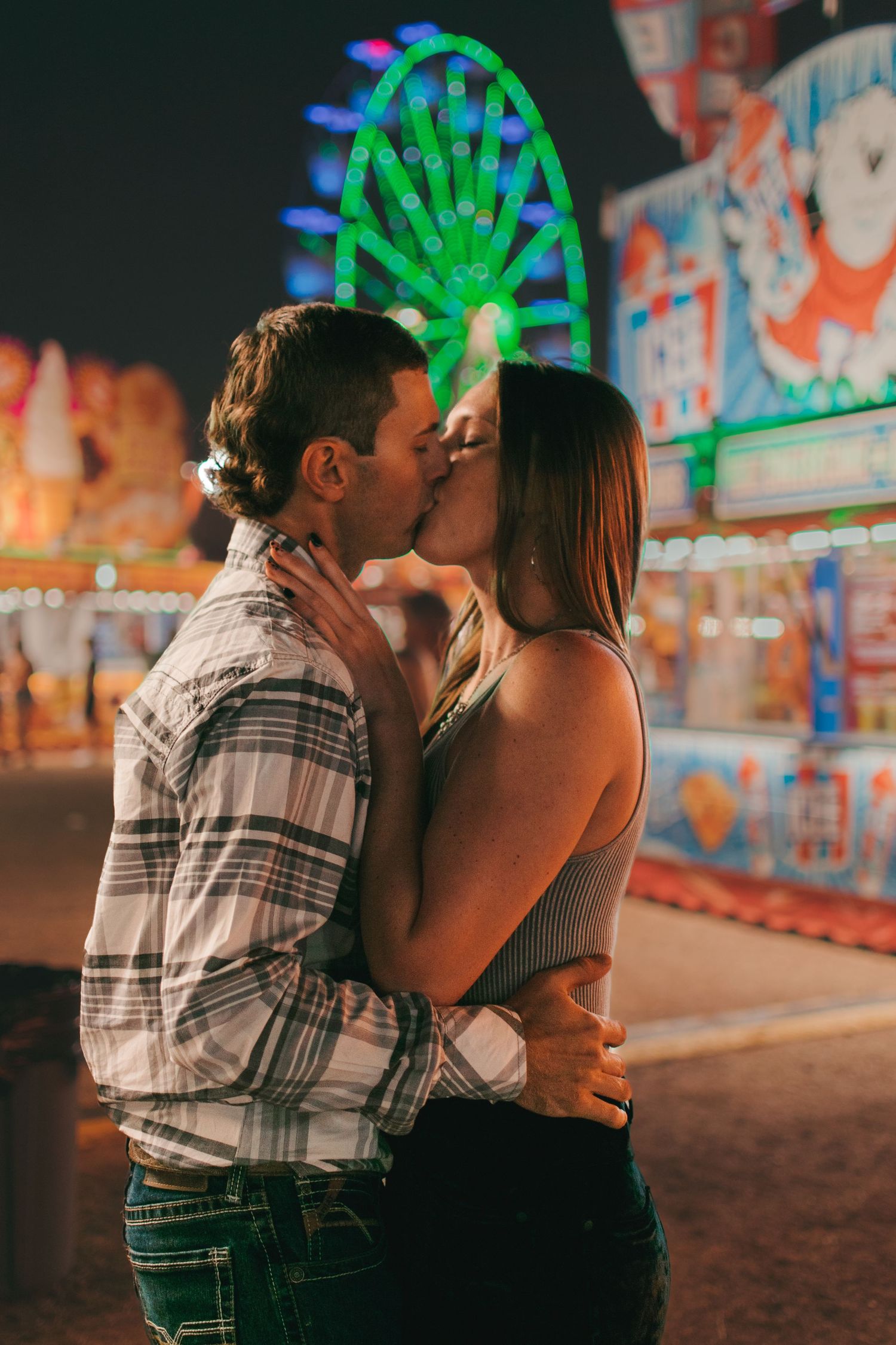 The Fair Is For Lovers... Ainsley responded to my model call for this carnival shoot so fast, it was fate. She and Jordan have been together for years, so their love was quite easy to capture on camera. We had so much fun playing carnival games, riding the rides, and capturing all of the memories on camera. The Indian River County Firefighters fair is one of my favorite things to come to Vero Beach and every year I try to go. Their outfits were the perfect combination of casual and cute while fitting the fair aesthetic perfect. This was easily one of my favorite sessions and I plan to make it an annual thing.